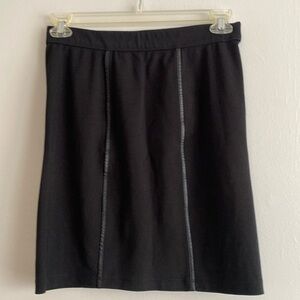 Black short skirt with leather decoration, size M
